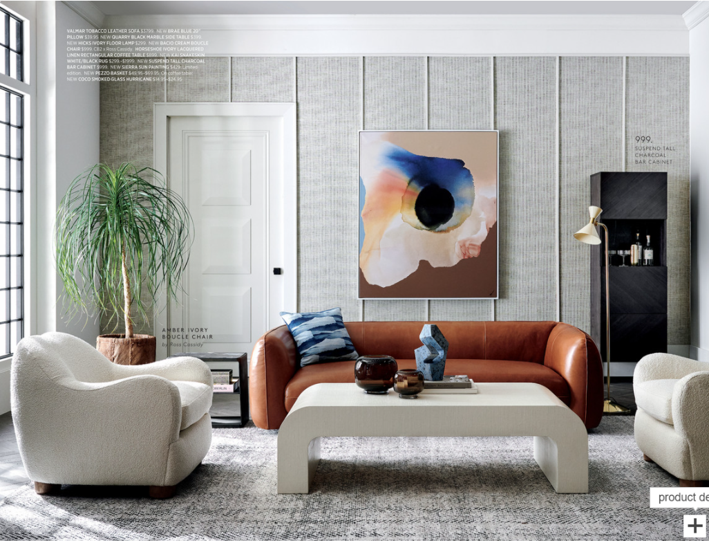 CB2 furniture catalog showing masculine living room setup